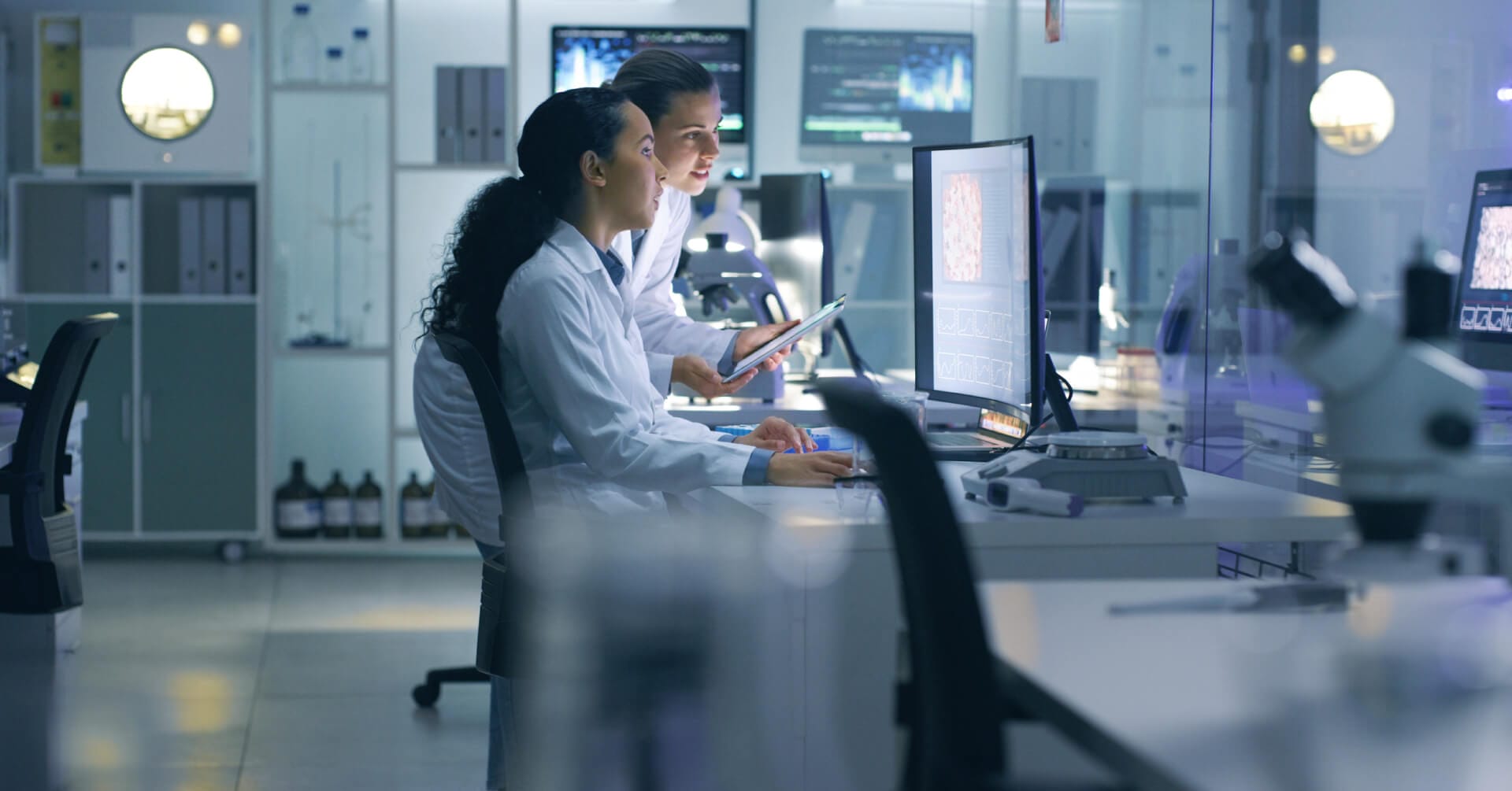 Employees at the lab computer