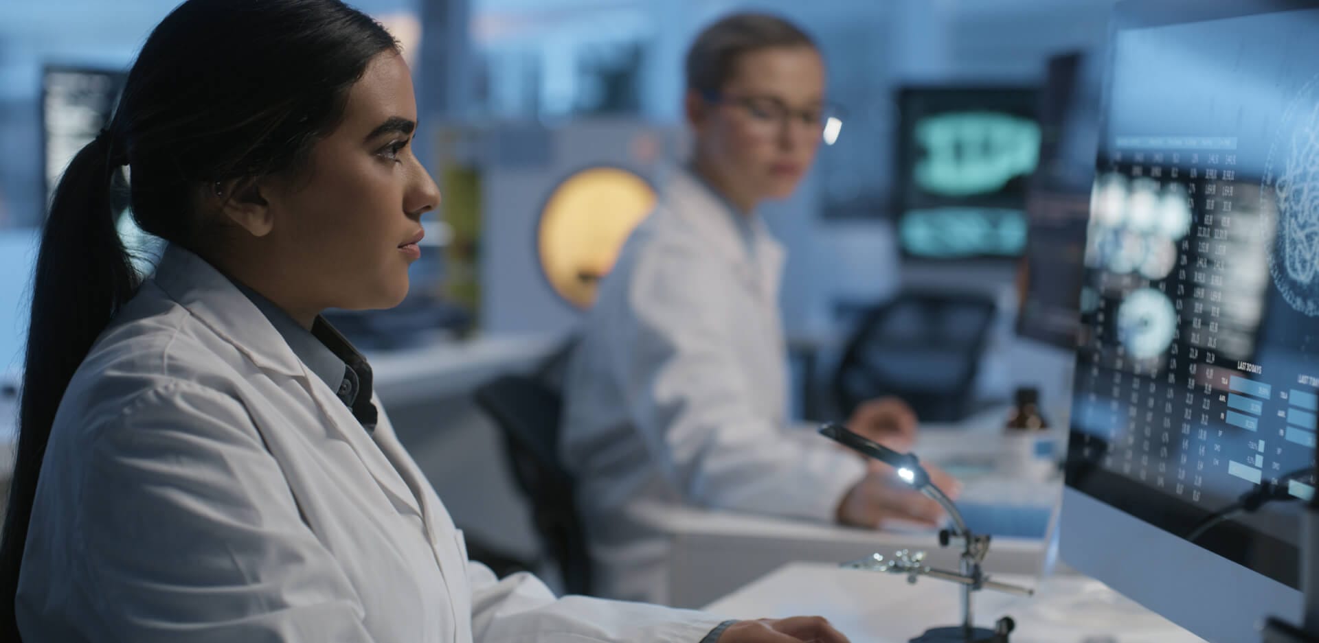 Scientist in computer lab at work